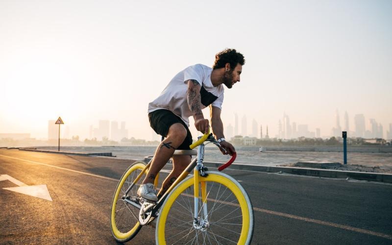 Find your perfect fit at Vesada a man riding a bicycle on a road