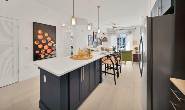 a kitchen with a bar and a table