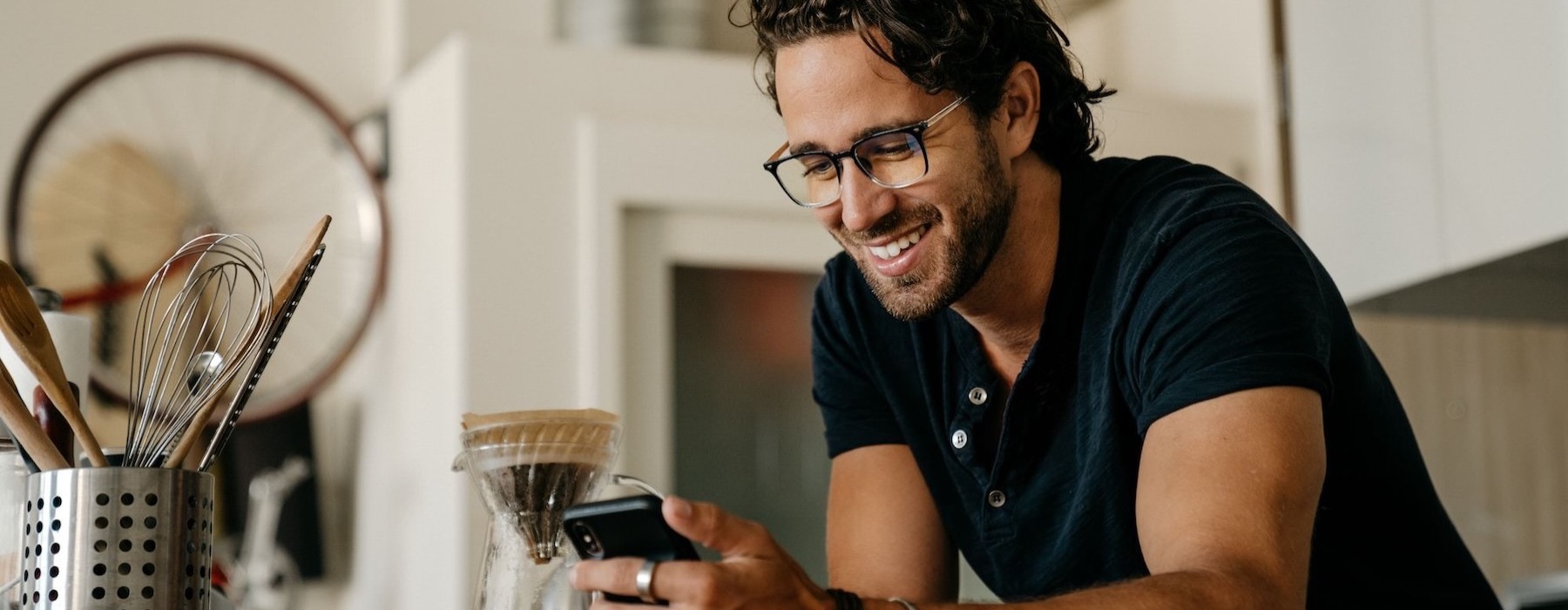 Settle into comfort at Vesada a man holding a phone